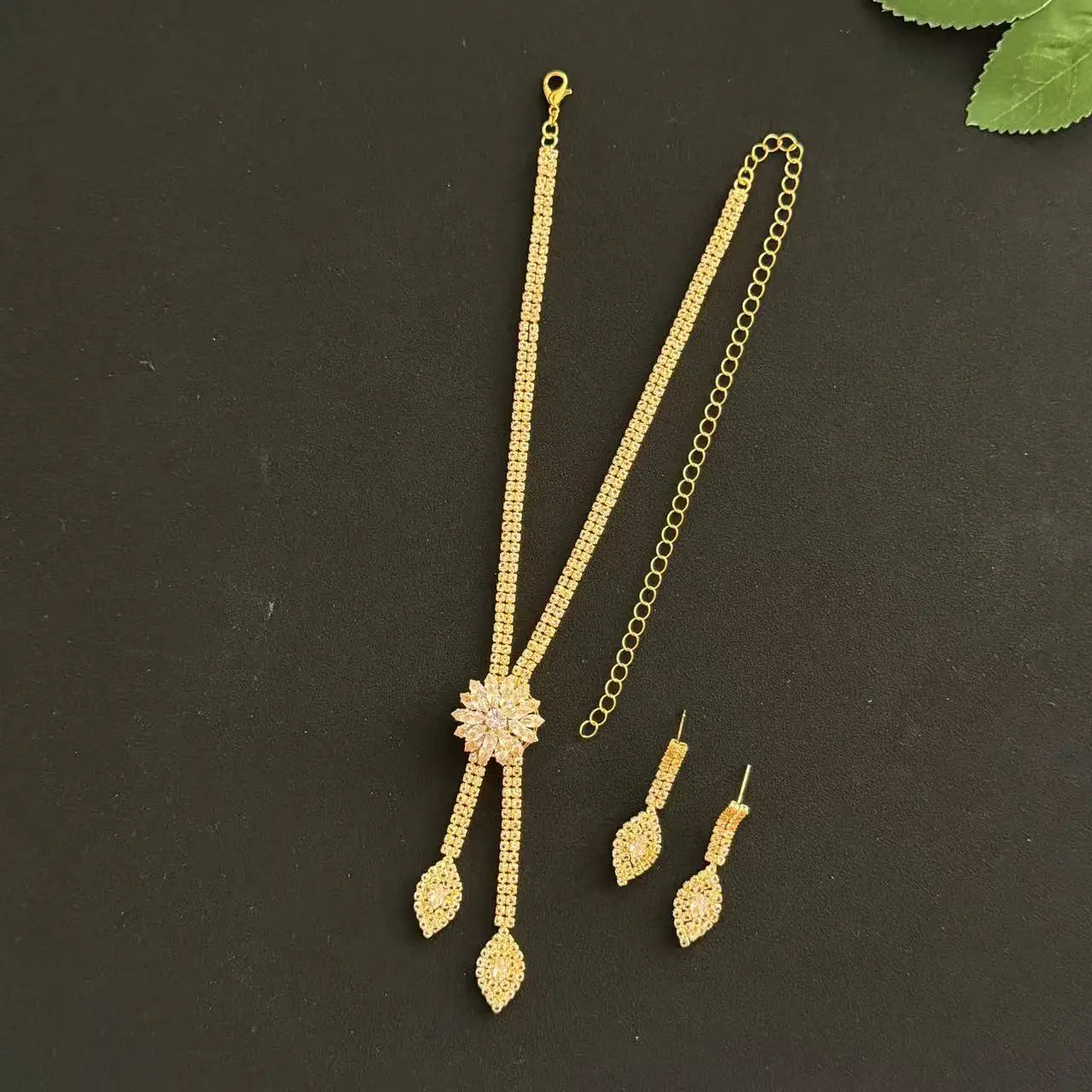 A three piece jewelry set with exquisite patterns and stunning necklaces and earrings, perfect for parties and banquets