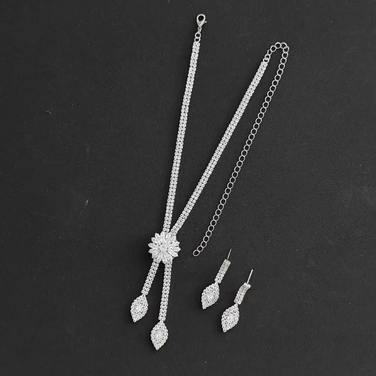A three piece jewelry set with exquisite patterns and stunning necklaces and earrings, perfect for parties and banquets